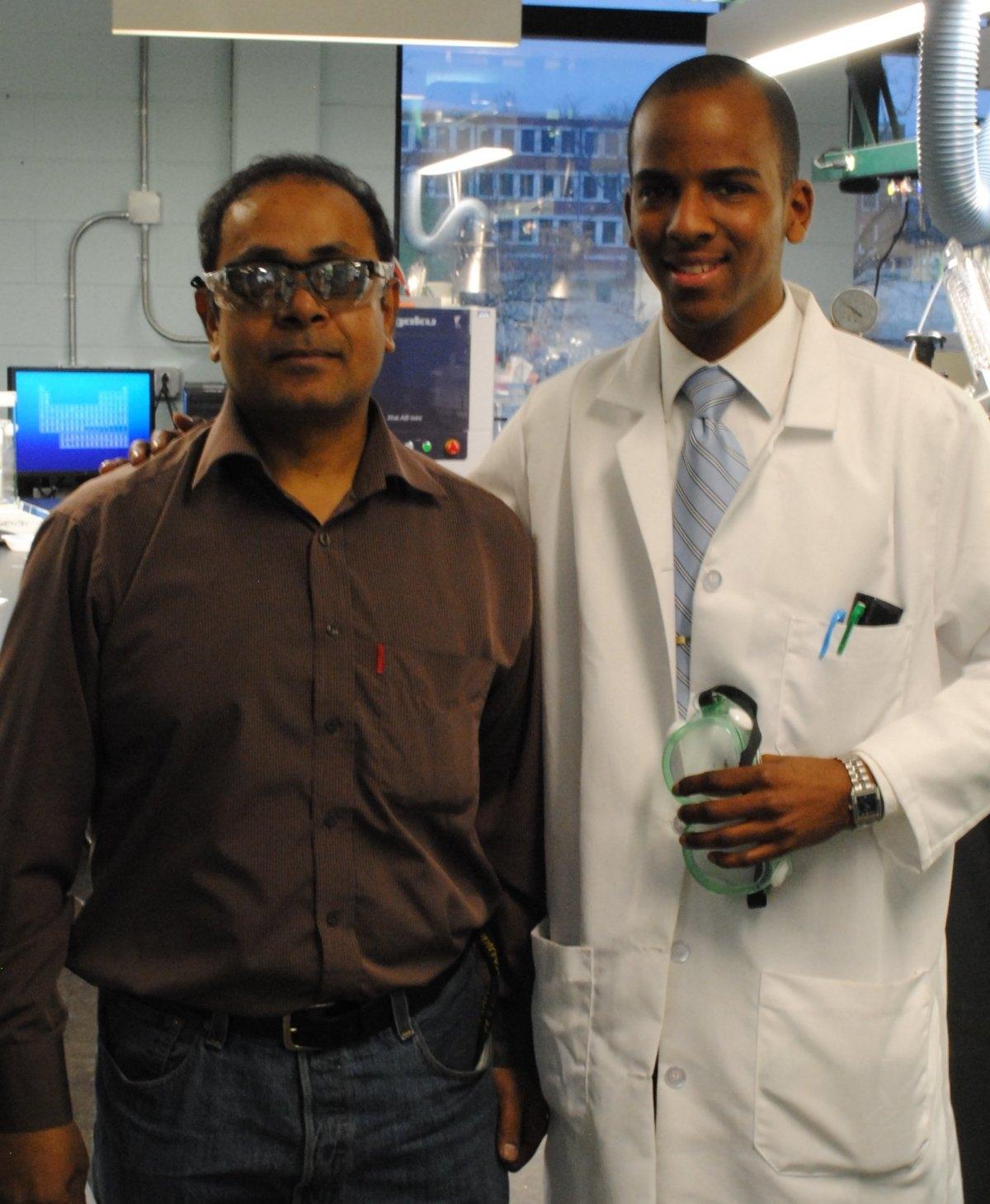 student on campus with faculty